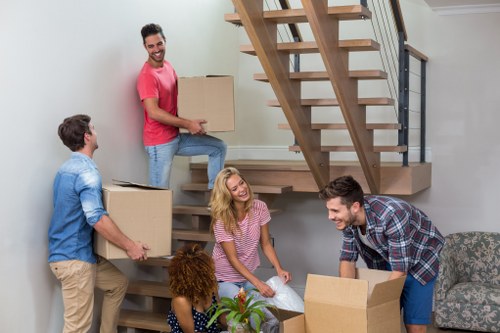 Commercial moving team handling office furniture in West London
