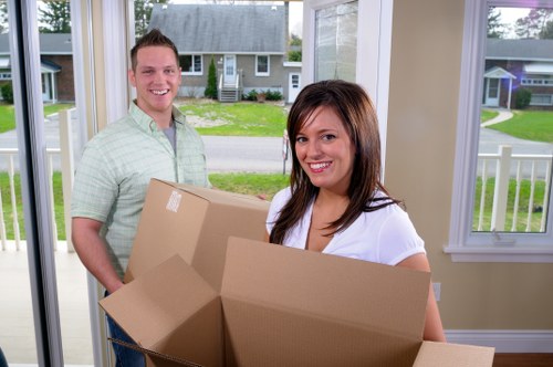 Careful packing of fragile household items in a Notting Hill property