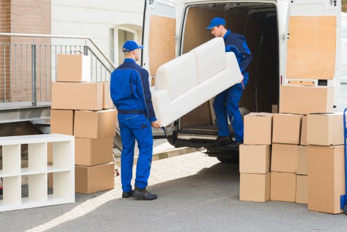 Packed office equipment ready for relocation in Notting Hill