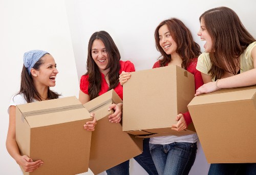 Local moving team handling boxes and furniture in Notting Hill