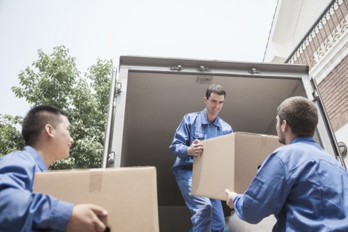 Careful loading of furniture and boxes for a local move in Notting Hill