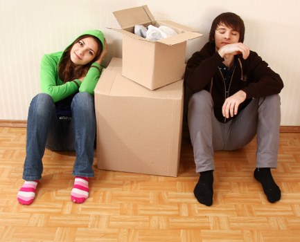 Local moving team unpacking boxes in a Notting Hill flat