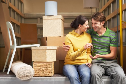 Boxes and furniture arranged to show cubic-yard pricing for a local removal