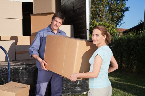 Removal van moving furniture near Notting Hill buildings